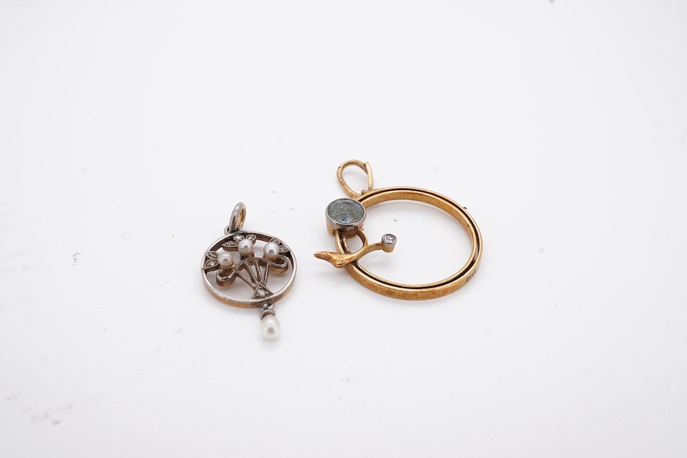 An early 20th century yellow metal, diamond chip and seed pearl set drop pendant, overall 23mm, together with a similar yellow metal, diamond and gem set open work pendant, diameter 20mm, gross weight 3.7 grams. Conditio